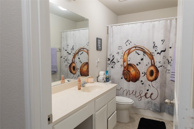 bathroom featuring tile patterned flooring, vanity, a shower with curtain, and toilet