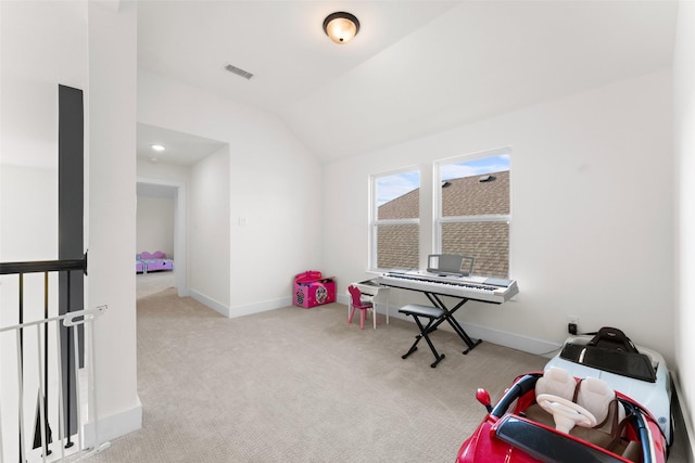 playroom featuring vaulted ceiling and light carpet