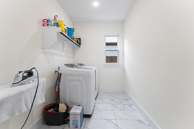 washroom featuring washing machine and clothes dryer