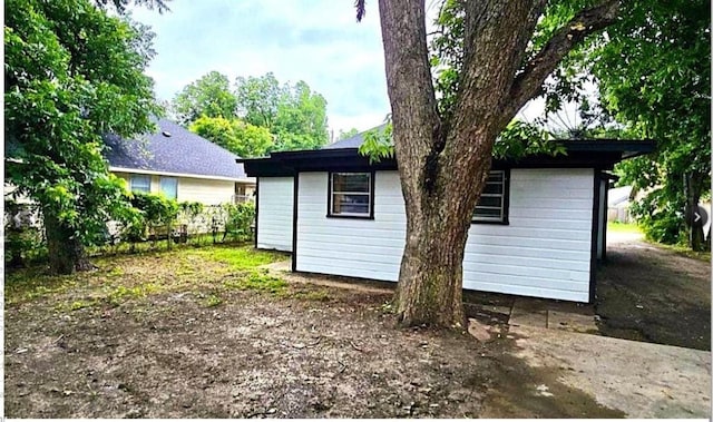 back of property with an outbuilding