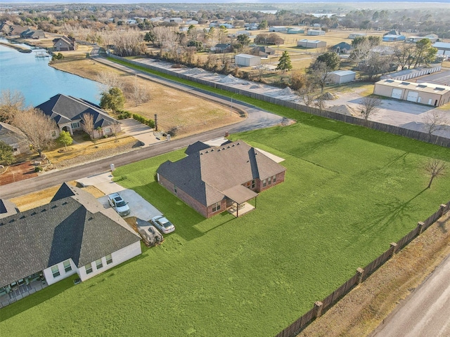 birds eye view of property featuring a residential view and a water view