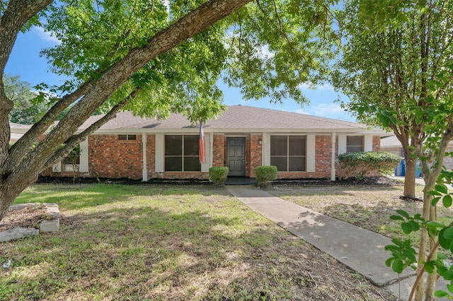 ranch-style house with a front lawn