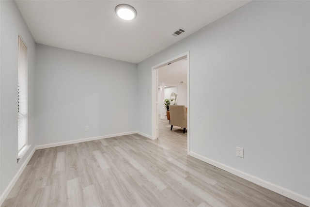 unfurnished room featuring light hardwood / wood-style floors