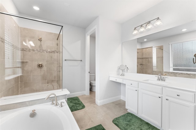 bathroom featuring baseboards, a shower stall, toilet, and a bath