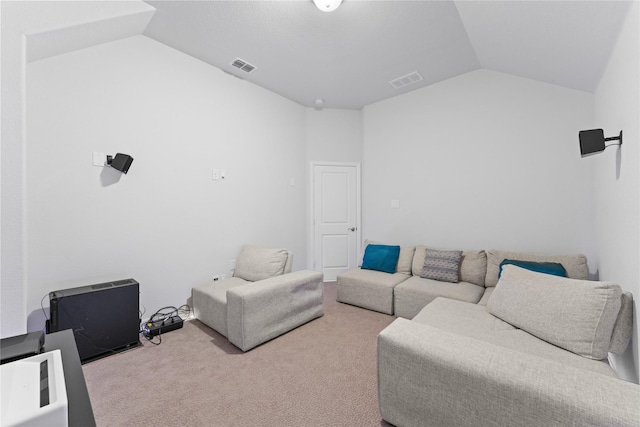 carpeted living room featuring visible vents and vaulted ceiling