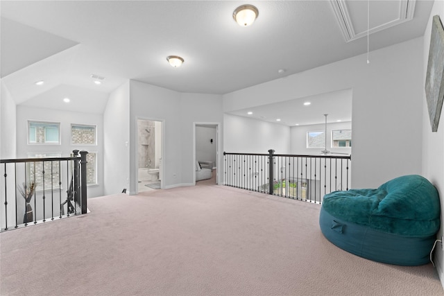 living area featuring carpet floors, an upstairs landing, attic access, and recessed lighting