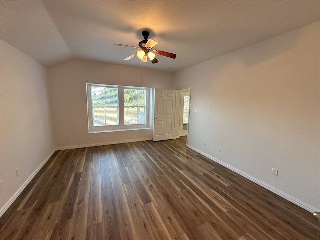 unfurnished room with dark hardwood / wood-style flooring, lofted ceiling, and ceiling fan