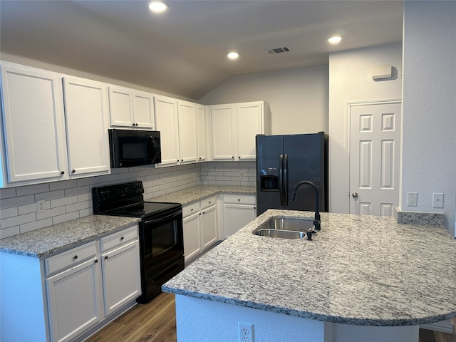 kitchen with dark wood-type flooring, white cabinets, sink, and black appliances