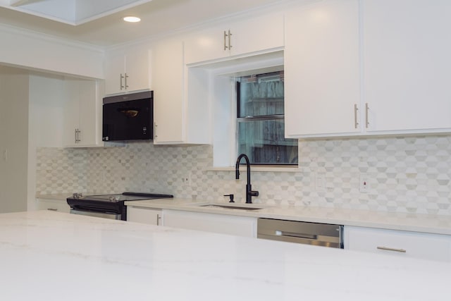 kitchen featuring sink, stainless steel appliances, ornamental molding, light stone countertops, and white cabinets