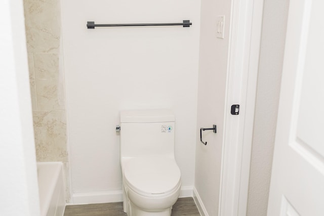 bathroom with wood-type flooring and toilet