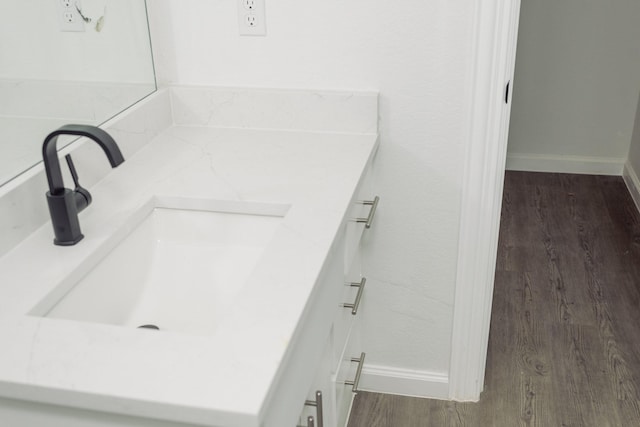 bathroom featuring vanity and wood-type flooring