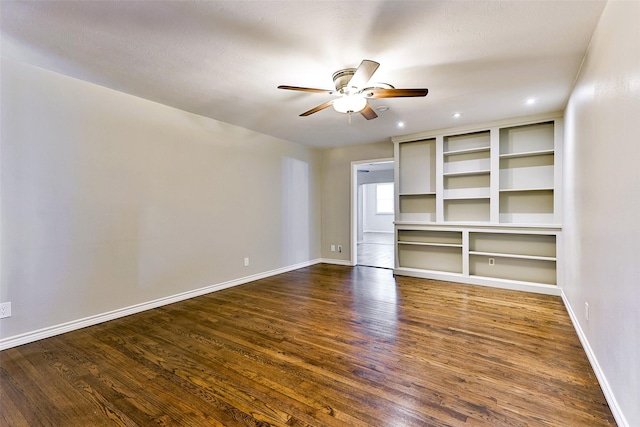 unfurnished living room with dark wood-type flooring and ceiling fan