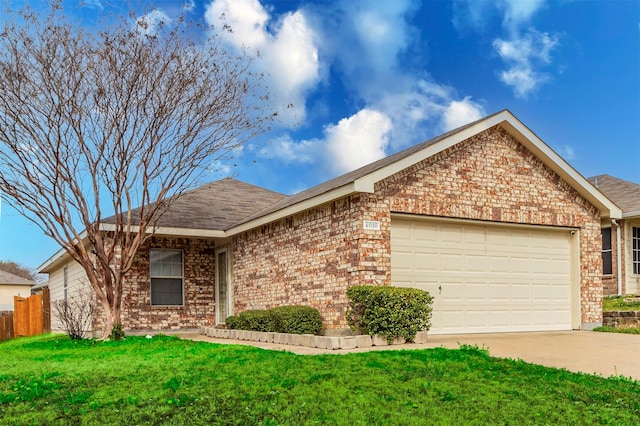 single story home featuring a garage and a front lawn