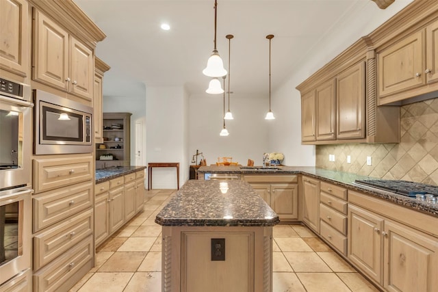 kitchen featuring a kitchen island, decorative light fixtures, dark stone counters, stainless steel appliances, and light brown cabinets