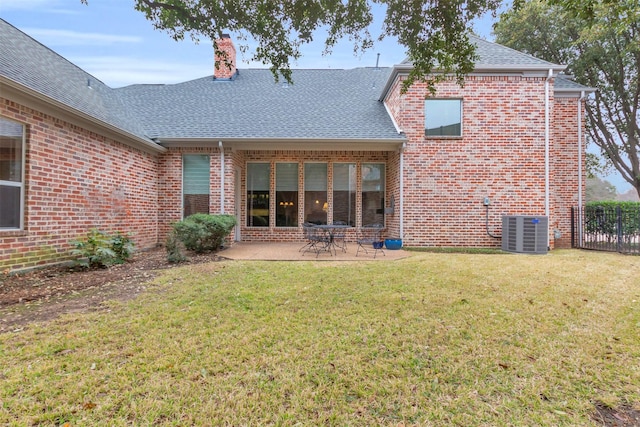 back of house with a patio, central AC unit, and a lawn