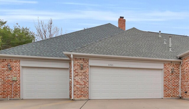 view of side of home featuring a garage