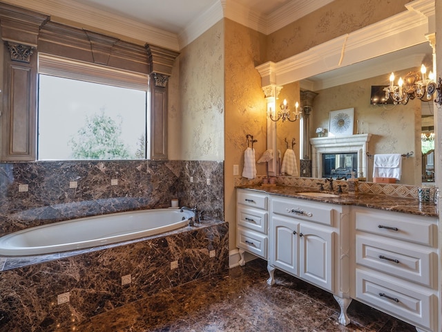 bathroom with ornamental molding, a relaxing tiled tub, vanity, and an inviting chandelier