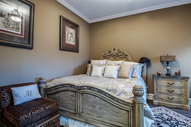 bedroom featuring hardwood / wood-style flooring and crown molding