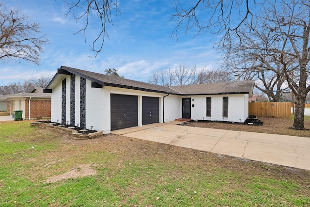 single story home with a garage and a front yard