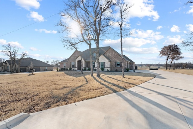 ranch-style house with a front lawn