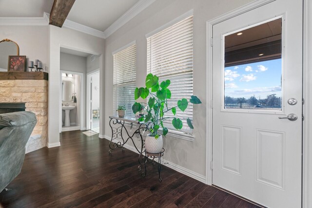 dining area with dark hardwood / wood-style flooring, crown molding, a fireplace, and an inviting chandelier