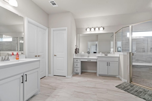 bathroom with vanity and an enclosed shower