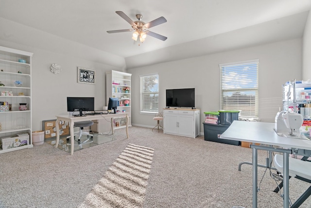 office area featuring a healthy amount of sunlight, light carpet, and ceiling fan