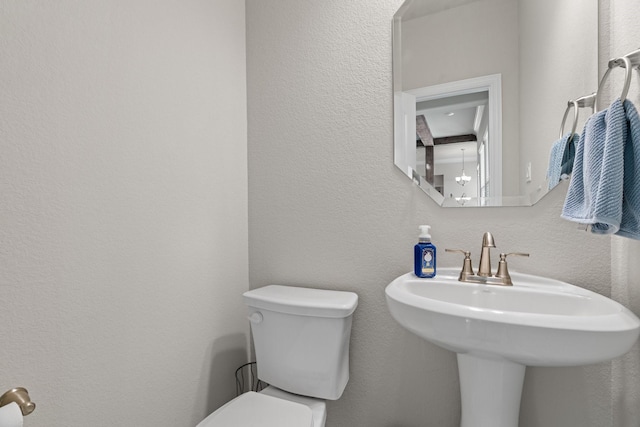 bathroom with sink and toilet