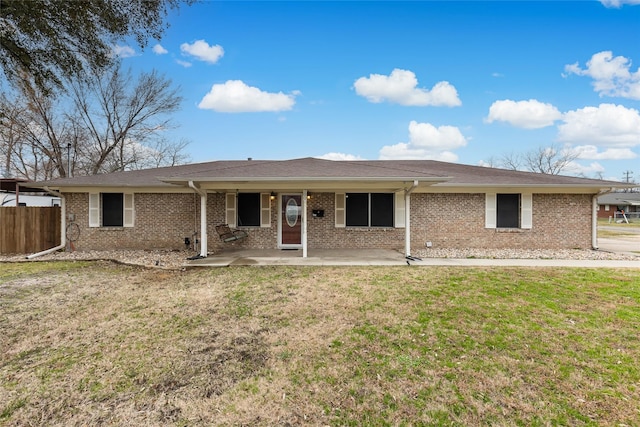 back of property featuring a yard and a patio area