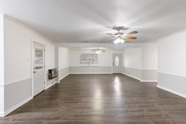 empty room featuring ornamental molding, dark hardwood / wood-style floors, and heating unit