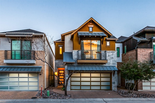 modern home featuring a balcony and a garage