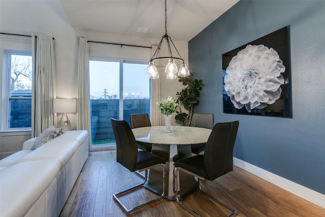 dining room with hardwood / wood-style flooring