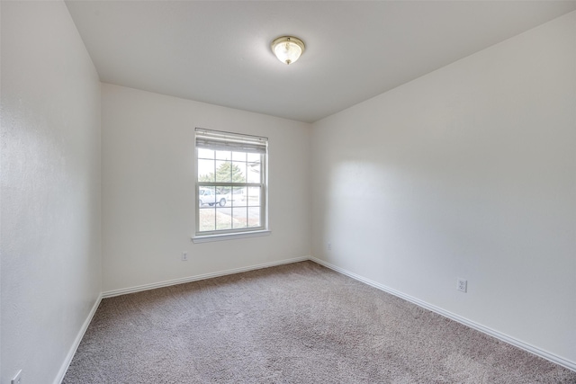 spare room featuring carpet floors