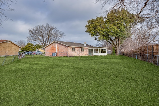 view of yard featuring a sunroom