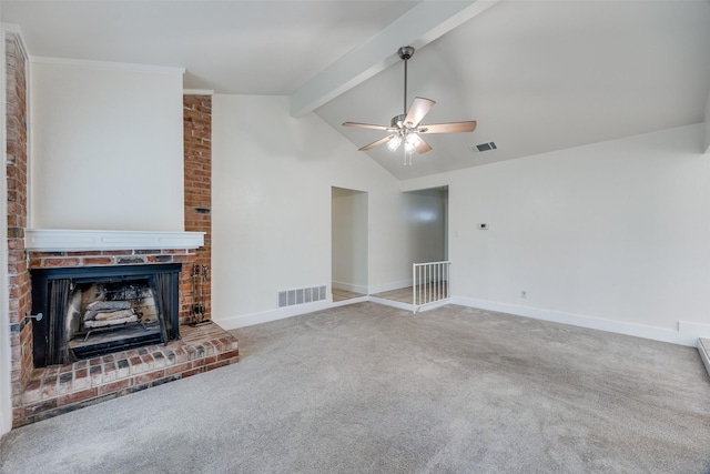 unfurnished living room featuring lofted ceiling with beams, a brick fireplace, carpet floors, and ceiling fan