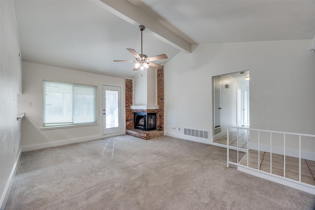 unfurnished living room with ceiling fan, a brick fireplace, light carpet, and vaulted ceiling with beams