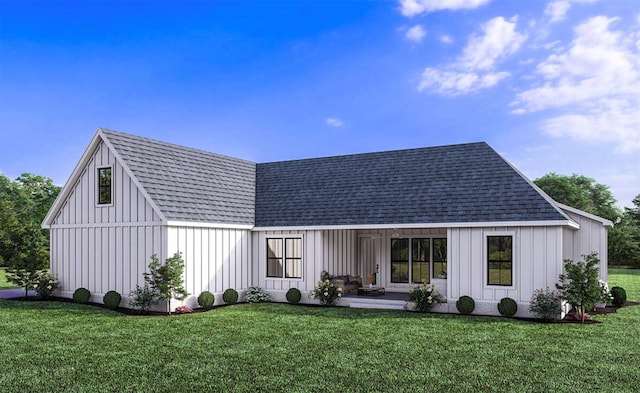 rear view of house with a lawn