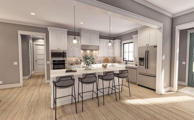 kitchen featuring pendant lighting, sink, white cabinets, a center island, and stainless steel appliances