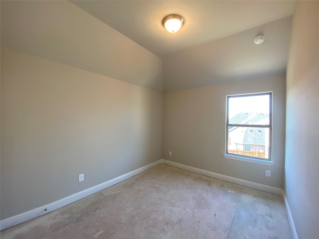 empty room with vaulted ceiling