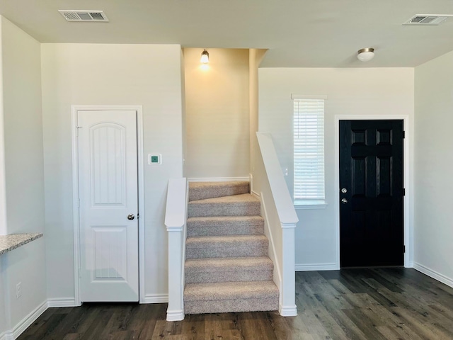 foyer with dark hardwood / wood-style floors