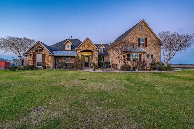 tudor-style house with a front yard