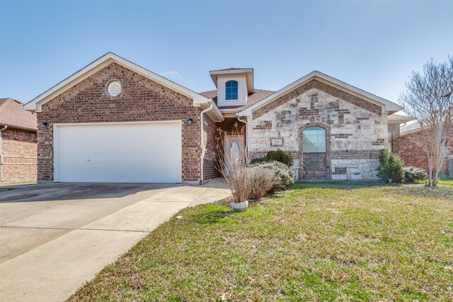 view of front facade with a garage and a front yard