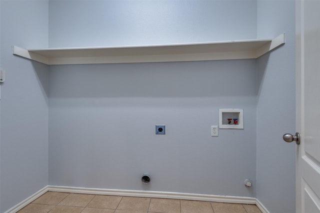 clothes washing area with hookup for a washing machine, light tile patterned floors, hookup for a gas dryer, and hookup for an electric dryer