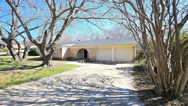 single story home featuring a garage