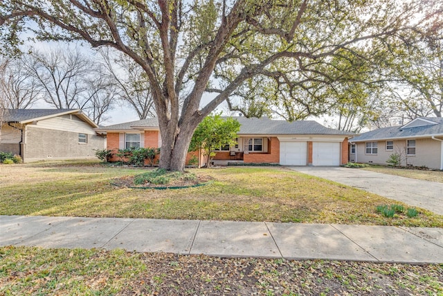 ranch-style house featuring a garage and a front yard