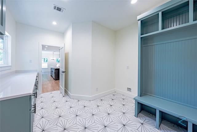 mudroom with recessed lighting, visible vents, and baseboards