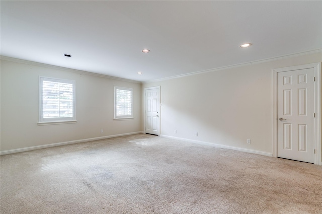 carpeted empty room featuring ornamental molding