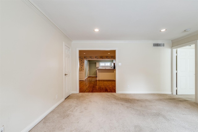 carpeted empty room with ornamental molding