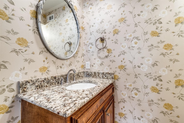 bathroom with vanity and crown molding