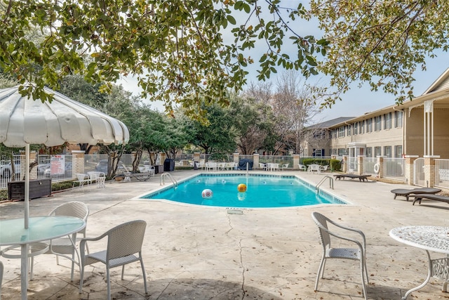 view of swimming pool with a patio area